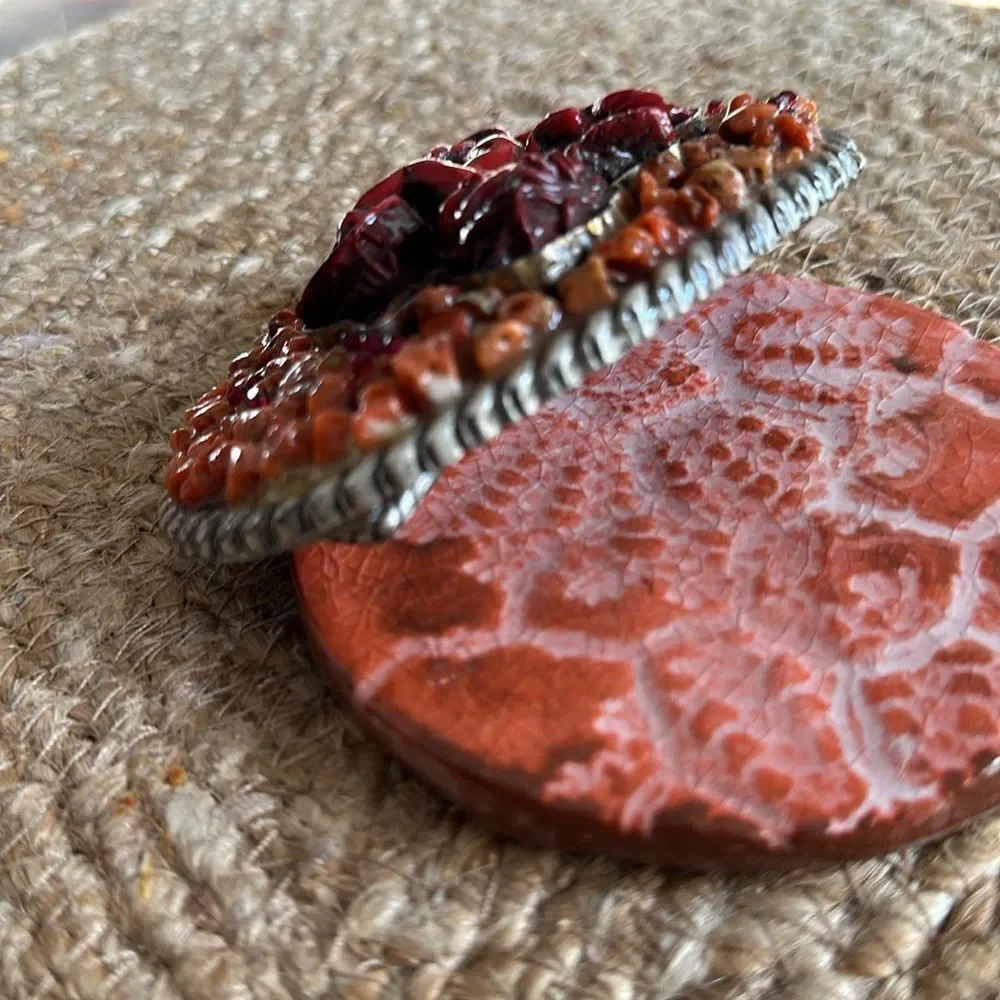 Handmade Coral Cherub belt buckle. One-of-a-kind.